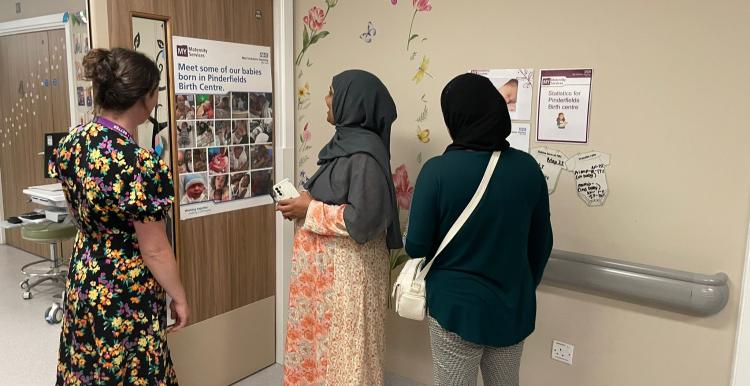 Women looking at a notice board at Pinderfields Hospital