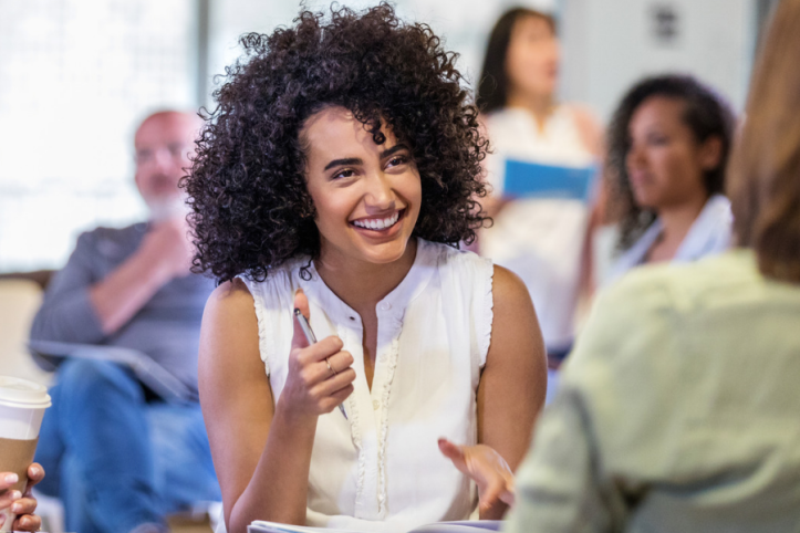 Smiling woman in a meeting