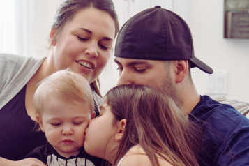 Young family sat together