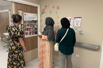 Women looking at a notice board at Pinderfields Hospital