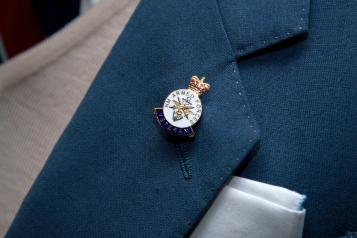 Close up of the Armed Forces veteran pin badge on a lapel