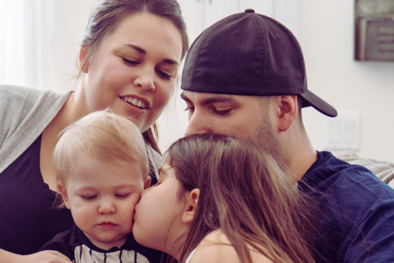 Young family sat together